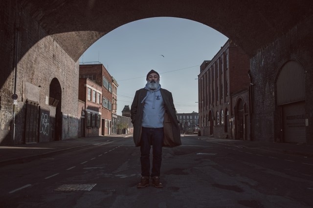 Man standing under archway